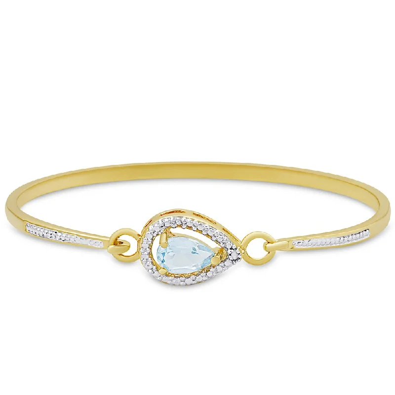 Dolce Giavonna Gold Overlay Blue Topaz and Diamond Accent Pear Design Bangle